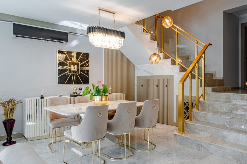 pexels photo 14598479 Modern dining room with marble table, gold accents, and stylish lighting.